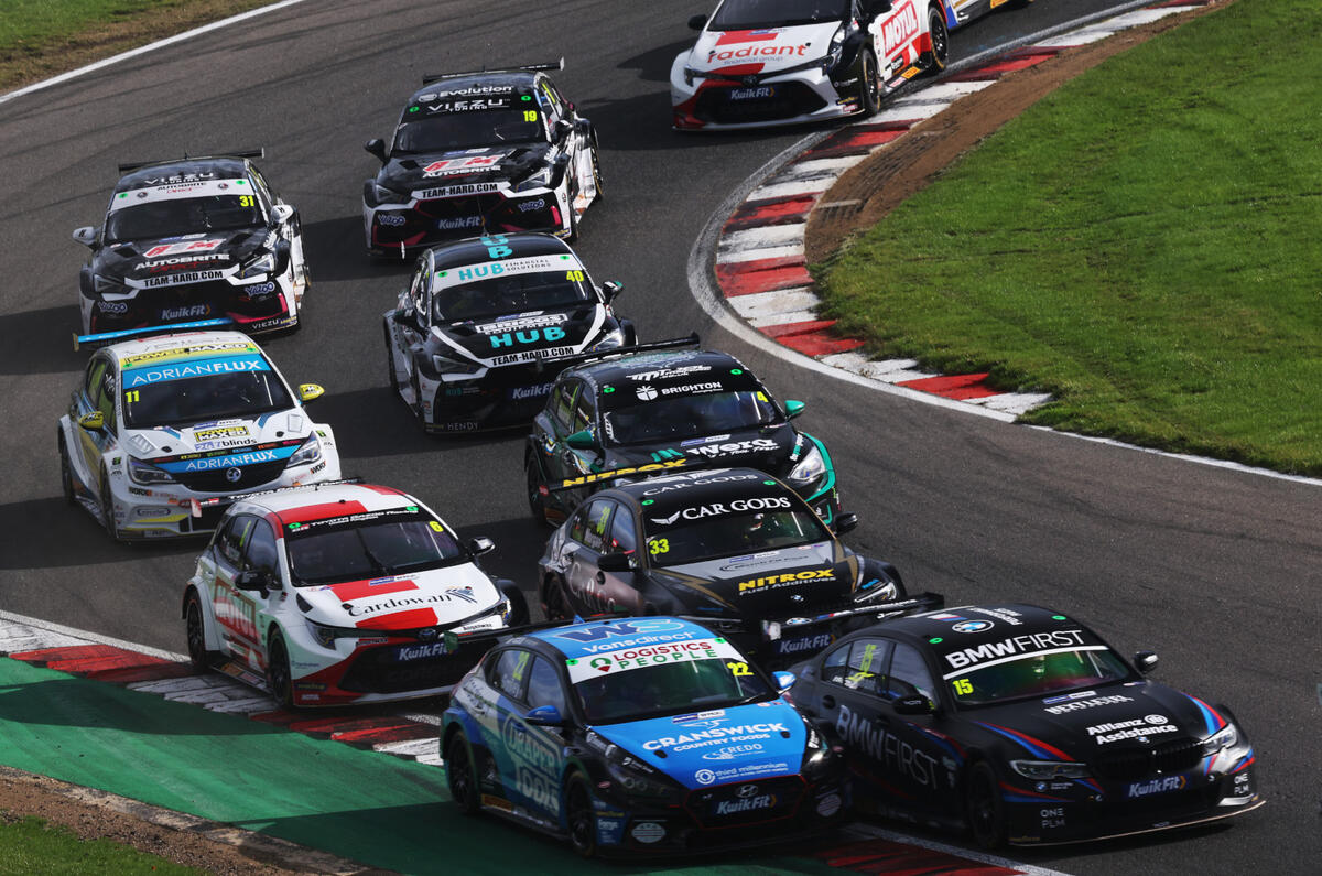 A tight pack of BTCC cars cornering