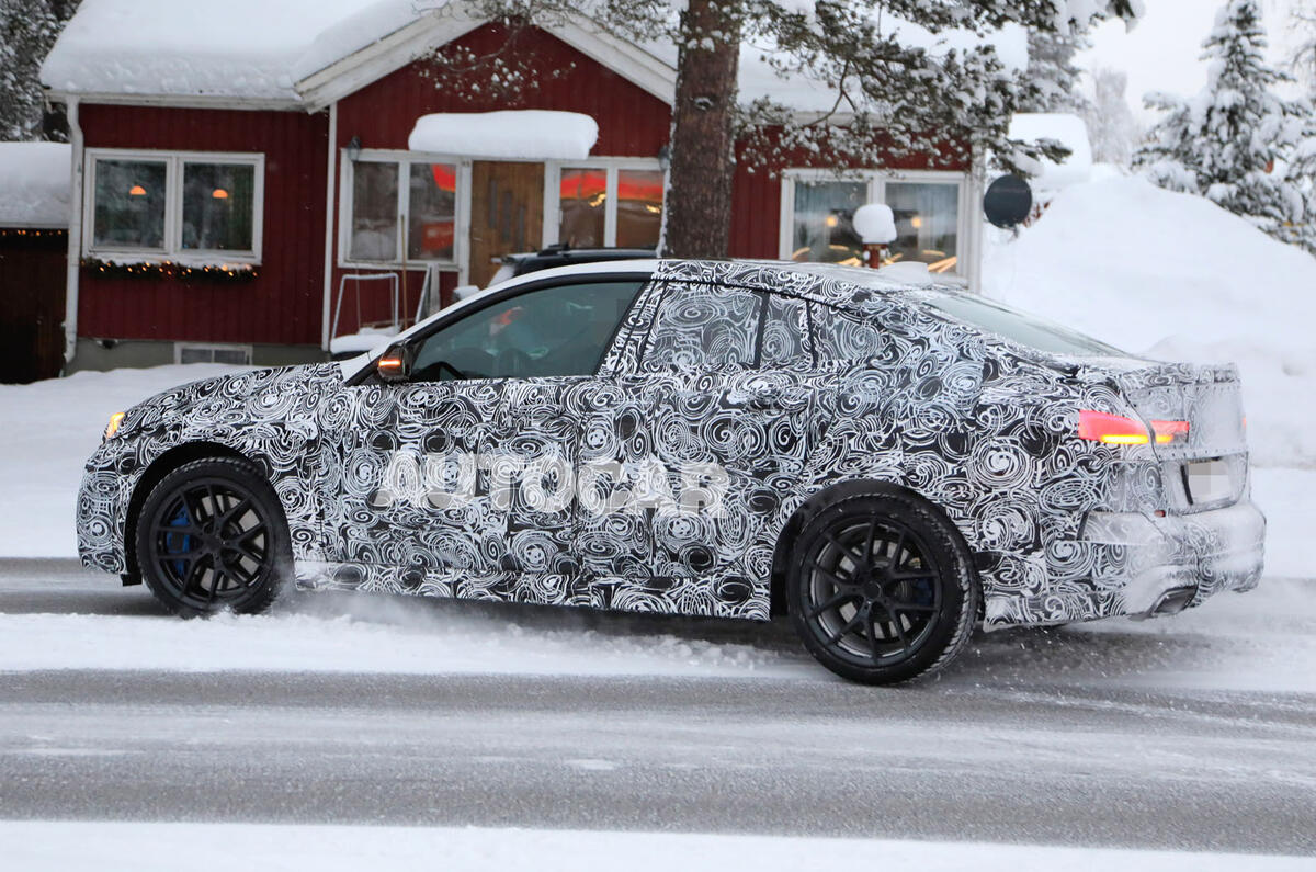 BMW 2 Series camouflage winter testing 2019 - leaving petrol station
