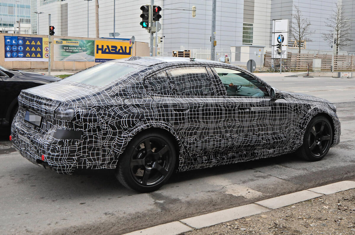 94 2024 BMW M5 hybrid spy images driving