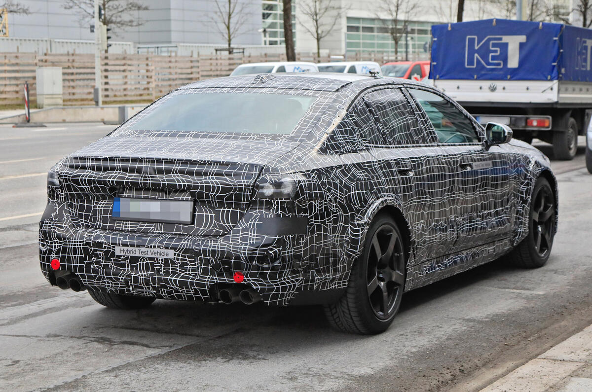 97 2024 BMW M5 hybrid spy images rear