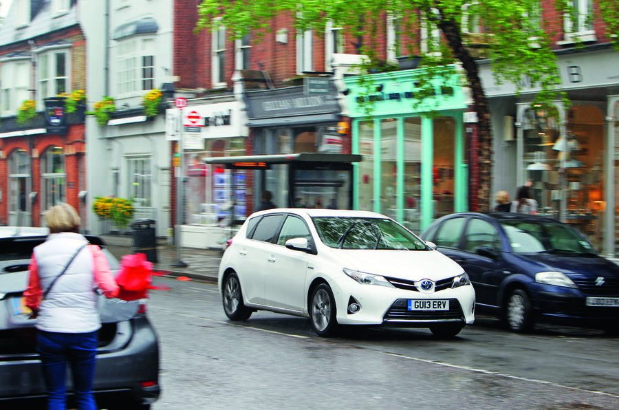 Toyota Auris driving on high street