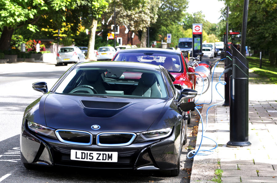 BMW i8 and Tesla Model S on street charging
