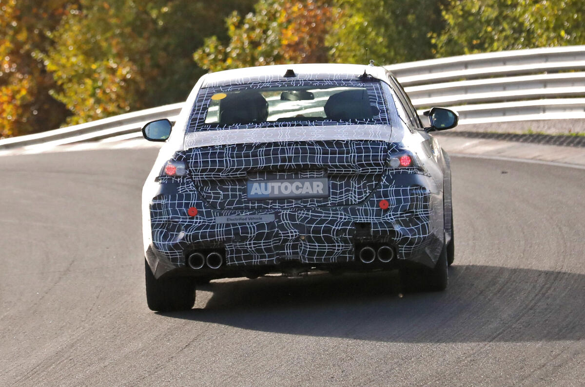 BMW M5 spied driving track rear 1
