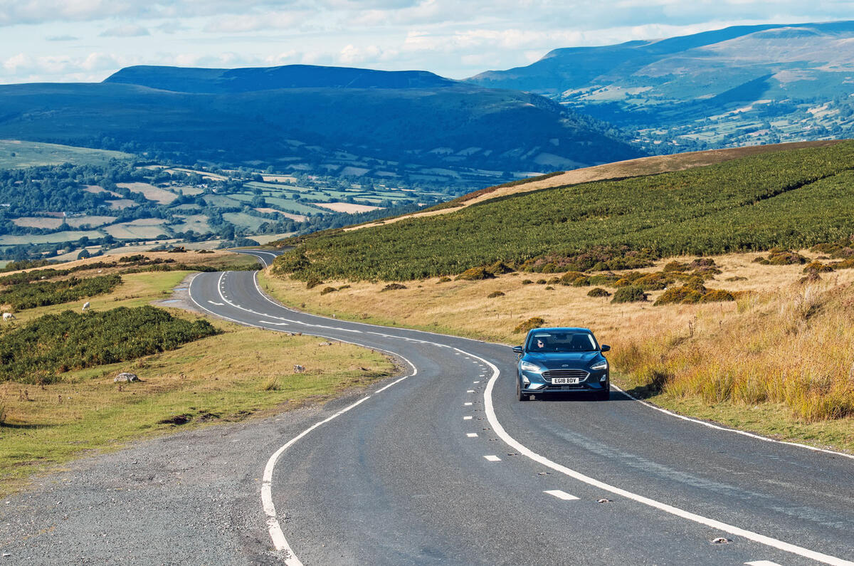 Ford Focus driving on a country road