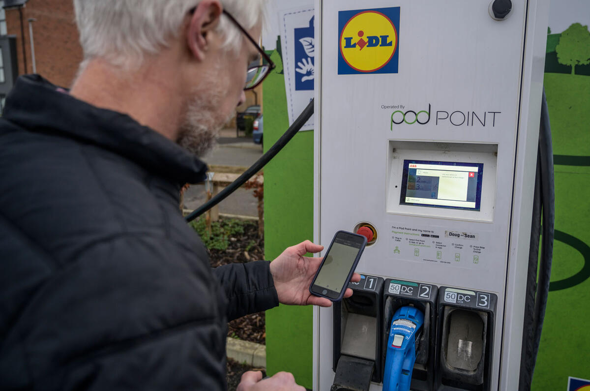 Man using Lidl electric car charger 2021