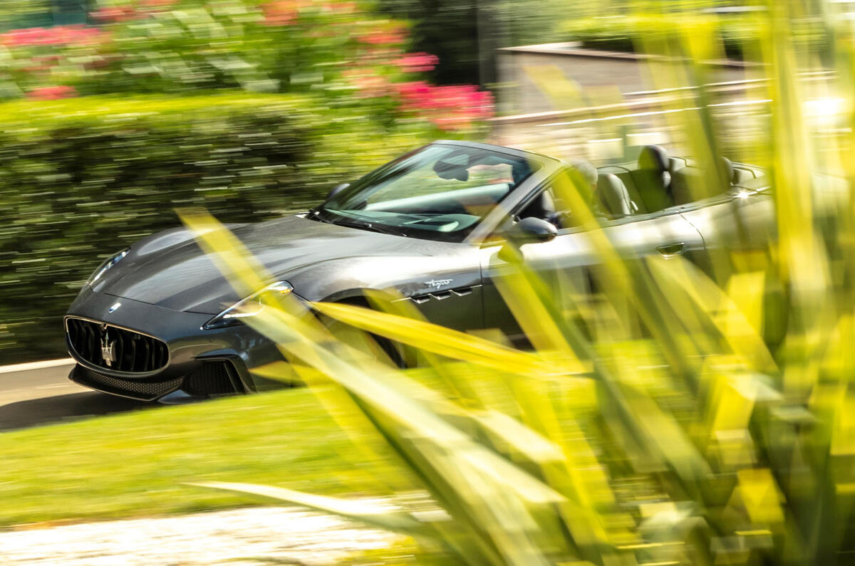 maserati GranCabrio behind bush