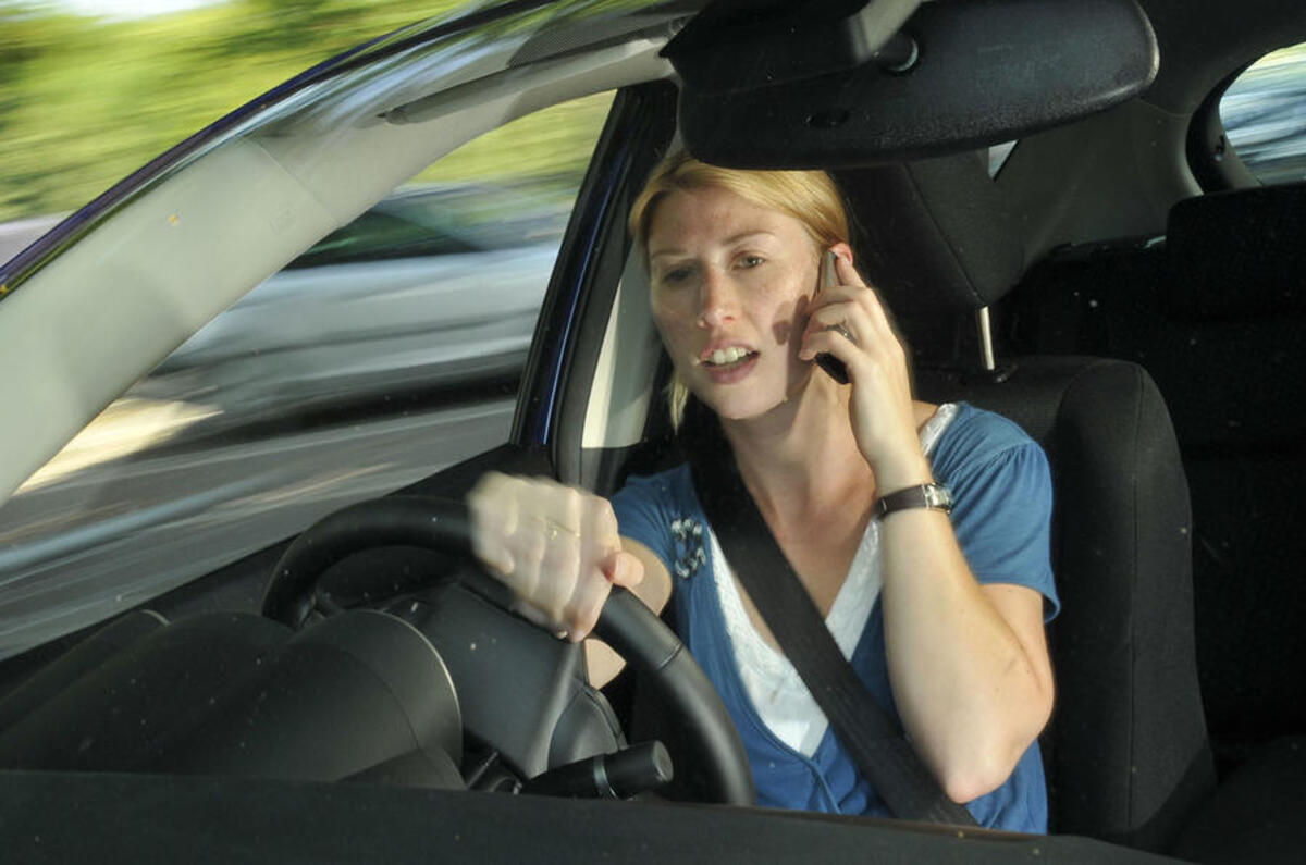 Record number of UK drivers caught using phones behind the wheel last year