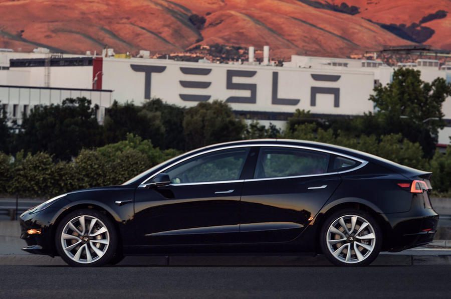 Tesla logo and car
