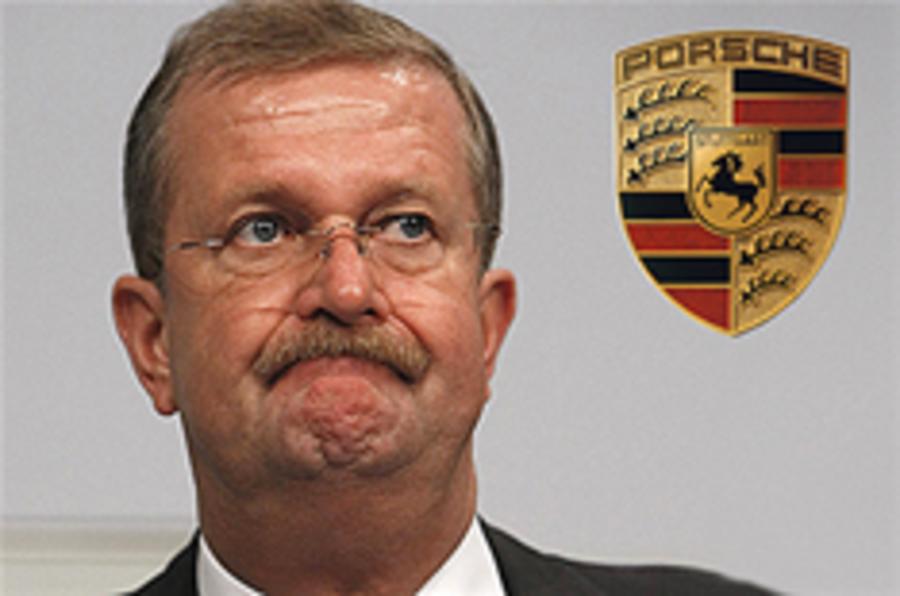 Porsche boss quits; VW merger on