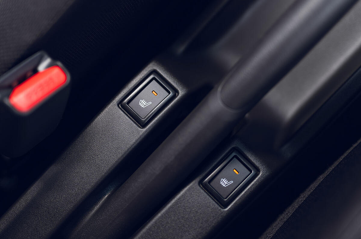 Bouton du siège chauffant de la Suzuki Swift