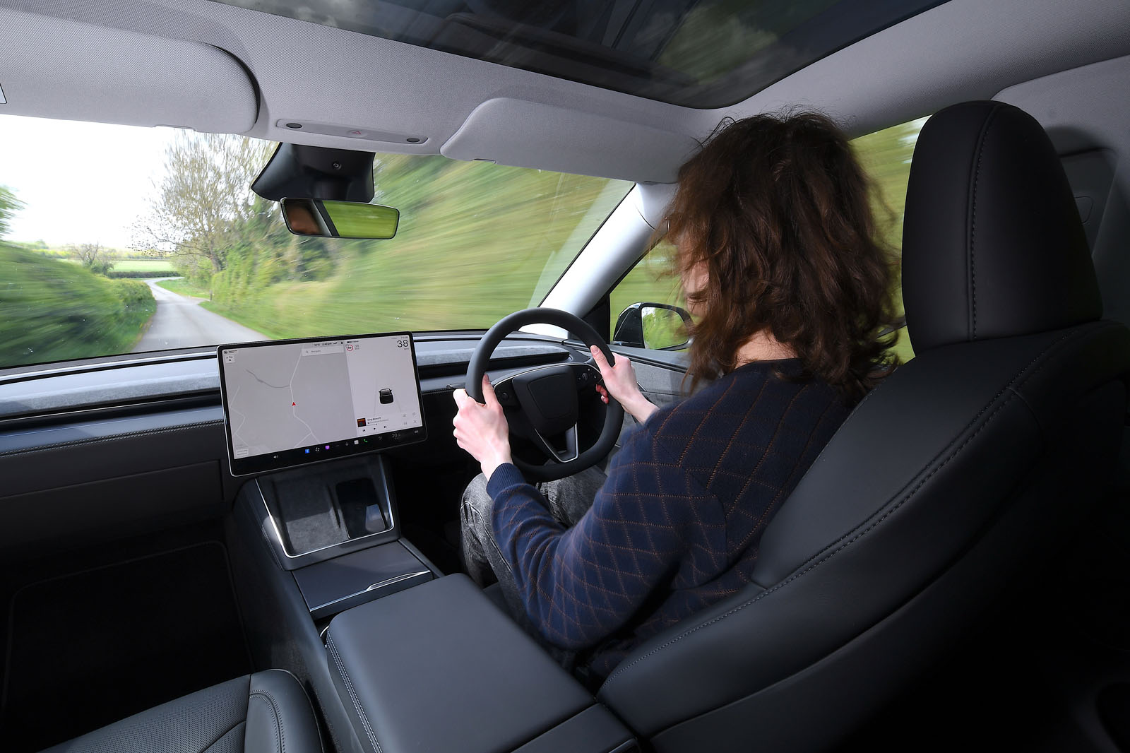 Tesla Model Y 2025 Review interior driving 9278